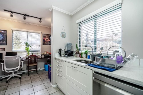 P02-223 Mountain Highway, North Vancouver, BC - Indoor Photo Showing Kitchen With Double Sink