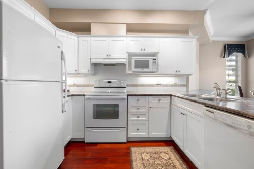 340-3098 Guildford Way, Coquitlam, BC - Indoor Photo Showing Kitchen With Double Sink