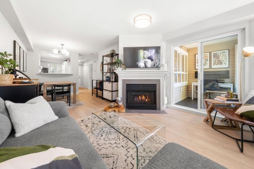 249-2565 Broadway W, Vancouver, BC - Indoor Photo Showing Living Room With Fireplace
