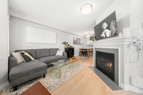 249-2565 Broadway W, Vancouver, BC - Indoor Photo Showing Living Room With Fireplace