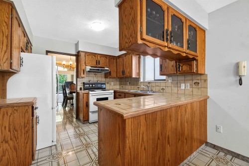 2739 E 8Th Avenue, Vancouver, BC - Indoor Photo Showing Kitchen With Double Sink