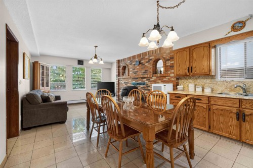 2739 E 8Th Avenue, Vancouver, BC - Indoor Photo Showing Dining Room With Fireplace