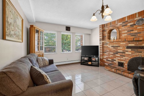 2739 E 8Th Avenue, Vancouver, BC - Indoor Photo Showing Living Room With Fireplace
