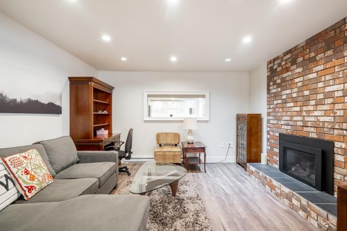 4241 Yuculta Crescent, Vancouver, BC - Indoor Photo Showing Living Room With Fireplace