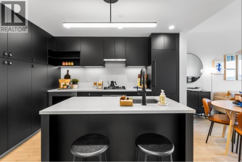 208-1680 12Th Avenue E, Vancouver, BC - Indoor Photo Showing Kitchen With Upgraded Kitchen