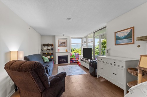 307-9298 University Crescent, Burnaby, BC - Indoor Photo Showing Living Room With Fireplace