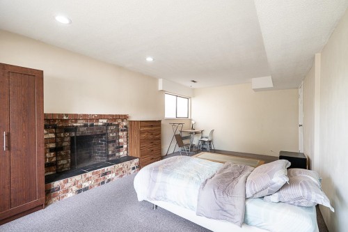 6496 Quebec Street, Vancouver, BC - Indoor Photo Showing Bedroom With Fireplace