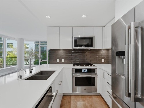 302-8533 River District Crossing, Vancouver, BC - Indoor Photo Showing Kitchen With Stainless Steel Kitchen With Double Sink With Upgraded Kitchen