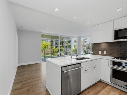 302-8533 River District Crossing, Vancouver, BC - Indoor Photo Showing Kitchen With Stainless Steel Kitchen With Double Sink With Upgraded Kitchen