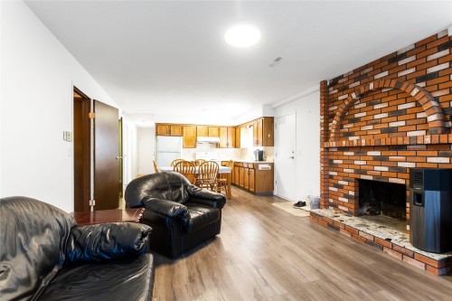 2986 3Rd Avenue E, Vancouver, BC - Indoor Photo Showing Living Room With Fireplace