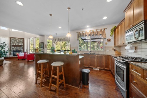 24781 Mcclure Drive, Maple Ridge, BC - Indoor Photo Showing Kitchen With Fireplace With Upgraded Kitchen