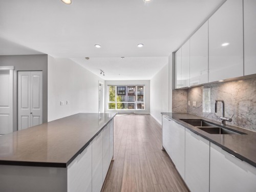 204-2651 Library Lane, North Vancouver, BC - Indoor Photo Showing Kitchen With Double Sink With Upgraded Kitchen