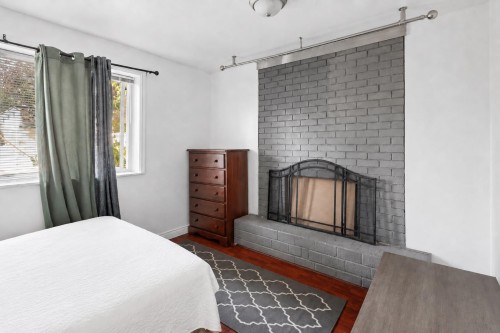3464 Vincent Street, Port Coquitlam, BC - Indoor Photo Showing Bedroom With Fireplace