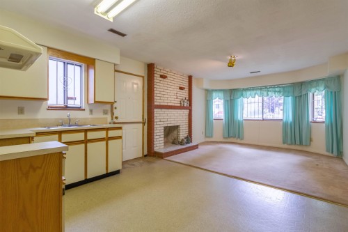 4467 Perry Street, Vancouver, BC - Indoor Photo Showing Kitchen With Fireplace