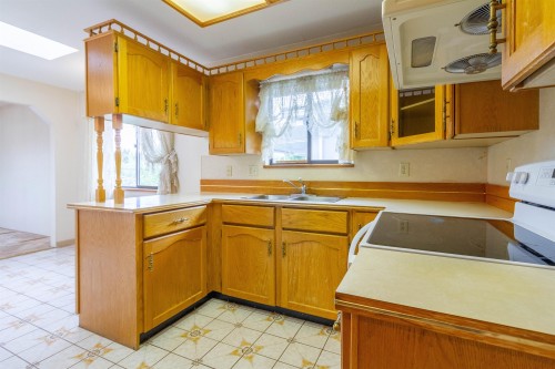 4467 Perry Street, Vancouver, BC - Indoor Photo Showing Kitchen With Double Sink