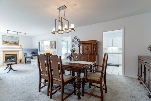 202-1131 55 Street, Delta, BC - Indoor Photo Showing Dining Room With Fireplace