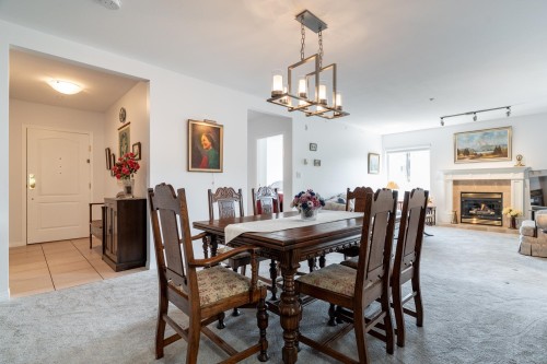 202-1131 55 Street, Delta, BC - Indoor Photo Showing Dining Room With Fireplace