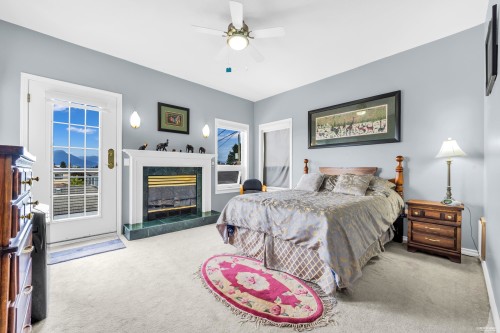 2381 40Th Avenue E, Vancouver, BC - Indoor Photo Showing Bedroom With Fireplace