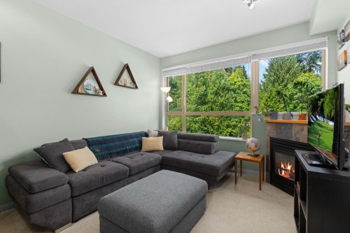 408-560 Ravenwoods Drive, North Vancouver, BC - Indoor Photo Showing Living Room With Fireplace