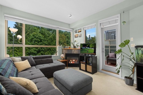 408-560 Ravenwoods Drive, North Vancouver, BC - Indoor Photo Showing Living Room With Fireplace
