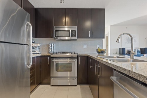 1603-651 Nootka Way, Port Moody, BC - Indoor Photo Showing Kitchen With Stainless Steel Kitchen With Double Sink With Upgraded Kitchen