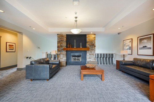 414-2958 Silver Spring Boulevard, Coquitlam, BC - Indoor Photo Showing Living Room With Fireplace