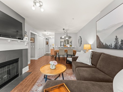 117-5900 Dover Crescent, Richmond, BC - Indoor Photo Showing Living Room With Fireplace