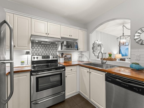 117-5900 Dover Crescent, Richmond, BC - Indoor Photo Showing Kitchen With Stainless Steel Kitchen With Double Sink