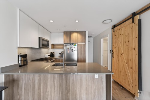 1103-8940 University Crescent, Burnaby, BC - Indoor Photo Showing Kitchen With Double Sink With Upgraded Kitchen