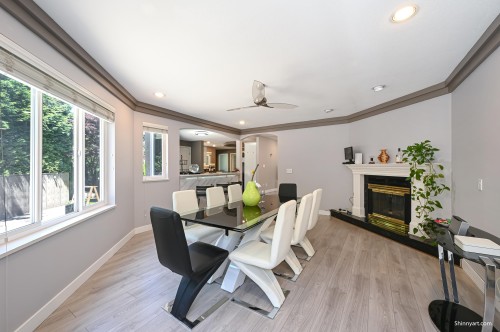 6339 Canada Way, Burnaby, BC - Indoor Photo Showing Dining Room With Fireplace
