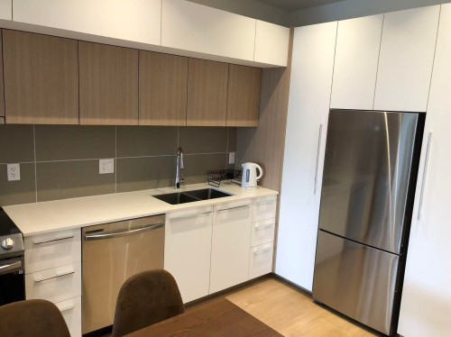 601-9888 University Crescent, Burnaby, BC - Indoor Photo Showing Kitchen With Double Sink