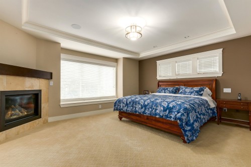 1325 Kingston Street, Coquitlam, BC - Indoor Photo Showing Bedroom With Fireplace