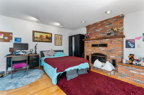 5564 Elizabeth Street, Vancouver, BC - Indoor Photo Showing Bedroom With Fireplace