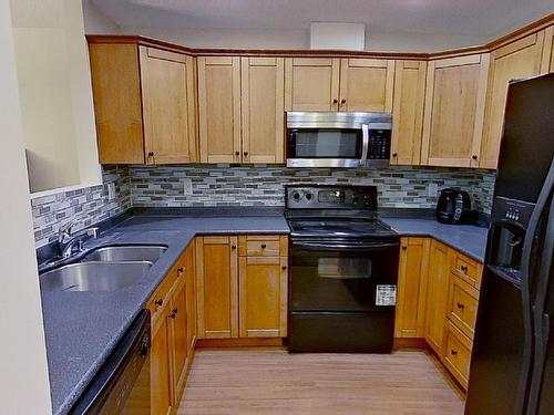 119 12110 106 Avenue Nw, Edmonton, AB - Indoor Photo Showing Kitchen With Double Sink