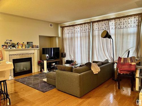 306 9020 Jasper Avenue, Edmonton, AB - Indoor Photo Showing Living Room With Fireplace