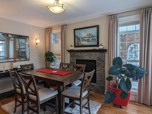 4337 49 Street, Vegreville, AB - Indoor Photo Showing Dining Room With Fireplace