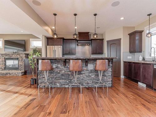 25 55101 Ste. Anne Trail, Rural Lac Ste. Anne County, AB - Indoor Photo Showing Kitchen With Fireplace With Upgraded Kitchen