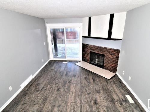 101 12408 161 Avenue, Edmonton, AB - Indoor Photo Showing Living Room With Fireplace