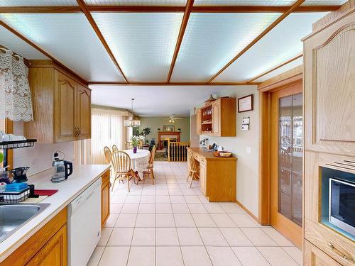 6119 156 Avenue, Edmonton, AB - Indoor Photo Showing Kitchen With Fireplace