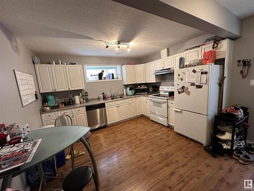 9637/9635 109A Avenue, Edmonton, AB - Indoor Photo Showing Kitchen With Double Sink