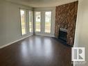 13832 28 Street, Edmonton, AB  - Indoor Photo Showing Living Room With Fireplace 