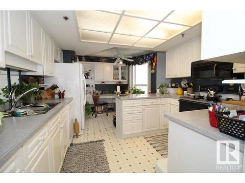 1401 12319 Jasper Avenue, Edmonton, AB - Indoor Photo Showing Kitchen With Double Sink