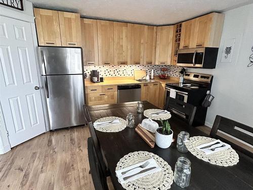 9735 107 Street, Westlock, AB - Indoor Photo Showing Kitchen With Double Sink