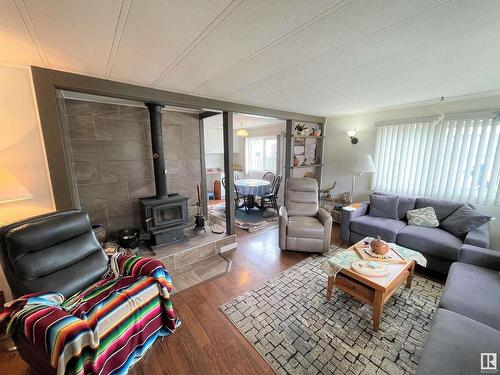 4902 51 Avenue, Ardmore, AB - Indoor Photo Showing Living Room With Fireplace