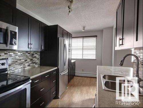 401 12331 Jasper Avenue, Edmonton, AB - Indoor Photo Showing Kitchen With Stainless Steel Kitchen With Double Sink With Upgraded Kitchen