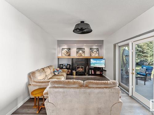 4415 46 Avenue, Bonnyville Town, AB - Indoor Photo Showing Living Room With Fireplace