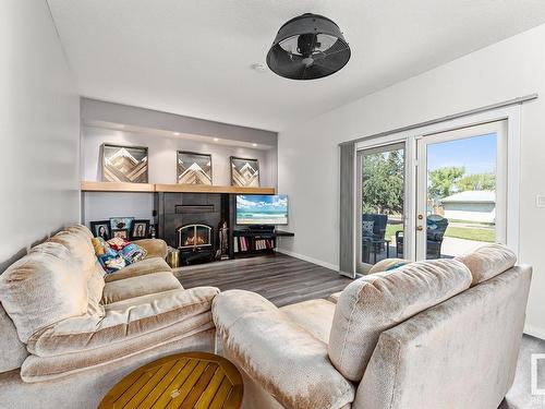 4415 46 Avenue, Bonnyville Town, AB - Indoor Photo Showing Living Room With Fireplace