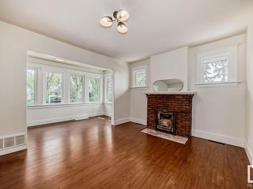 10514 128 Street, Edmonton, AB - Indoor Photo Showing Living Room With Fireplace