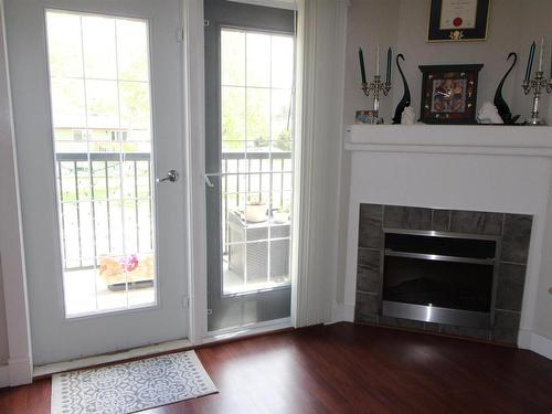 201 5401 37A Avenue, Wetaskiwin, AB - Indoor Photo Showing Living Room With Fireplace