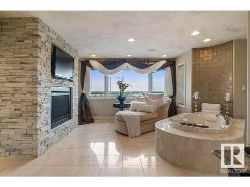 484 52304 Rge Rd 233, Rural Strathcona County, AB - Indoor Photo Showing Living Room With Fireplace